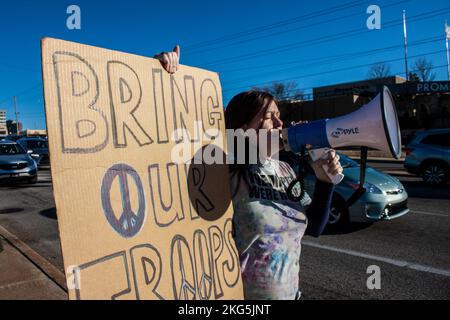 01-04-2020 Tulsa USA Potestor with megaphone and large homemade sign saying Bring our Troops Home on street corner Stock Photo