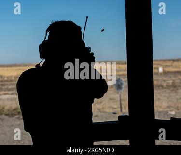 Col. Isaac T. Bell, 366th Fighter Wing Deputy commander, fires a Berretta M9 pistol at the off-base shooting range on Oct. 5, 2022 outside of Mountain Home Air Force Base, Idaho. Prior to deploying, weapons qualification on specific weapons are a requirement for Air Force members. Stock Photo