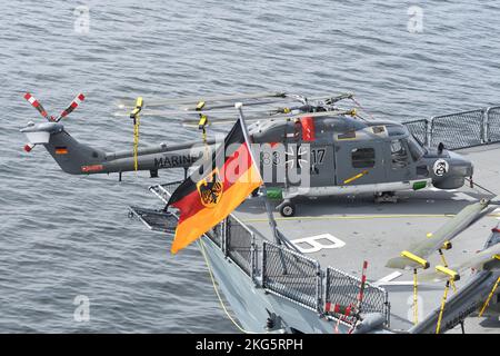 Tokyo, Japan - November 07, 2021: Naval Jack of German Navy and Westland Sea Lynx Mk.88A anti-submarine helicopter. Stock Photo