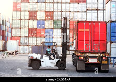 Forklift driver in industrial container warehouse Stock Photo