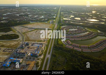 Aerial view of construction site with new tightly packed homes in Florida closed living clubs. Family houses as example of real estate development in Stock Photo