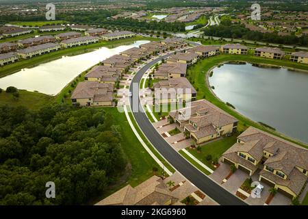 Aerial view of tightly located family houses in Florida closed suburban area. Real estate development in american suburbs Stock Photo