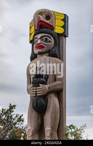 Detail of a Totem poll. Totem poles in White Rock,Vancouver, Canada. Colourful totem poles with carved birds, popular tourist attraction. Nobody, trav Stock Photo