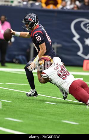 Washington Commanders defensive end Montez Sweat (90) sacks Houston Texans quarterback Davis Mills (10) during the NFL Football Game between the Washi Stock Photo