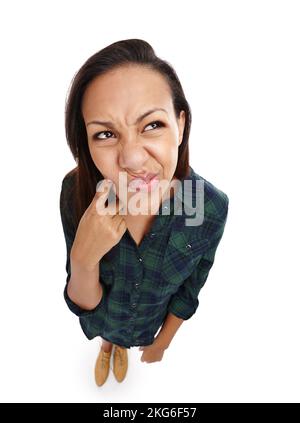 Its a tricky one. Portrait of an attractive young woman thinking hard isolated on white. Stock Photo