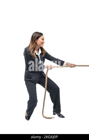 Asian businesswoman pulling rope isolated over white background Stock Photo