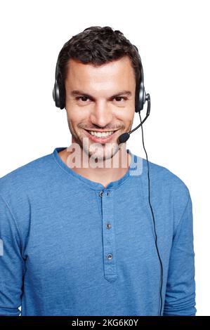 How may I help you. A casual male with a telecommunications headset on while smiling at the camera. Stock Photo