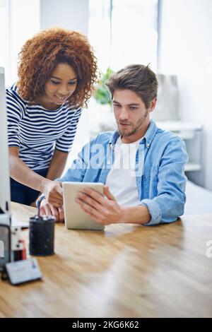 What about that. two colleagues working in their office. Stock Photo