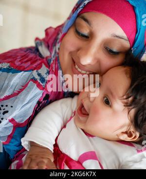 My beautiful baby girl. a muslim mother and her little baby girl. Stock Photo