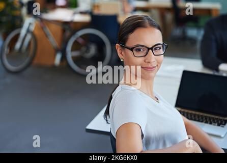 Developing tomorrows tech today. a designer at their workstation in an office. Stock Photo