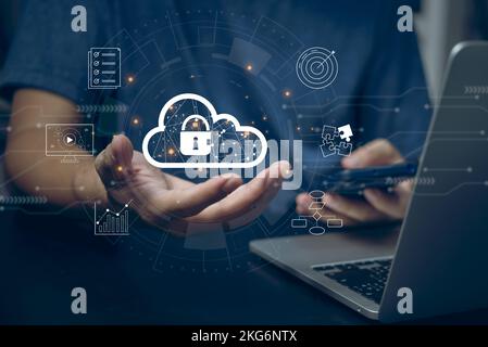 Cloud computing diagram technology Data storage internet networking software concept.Man use laptop computer with cloud on hand virtual screen. Stock Photo
