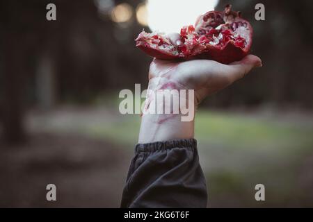 Close up mashed up pomegranate concept photo Stock Photo