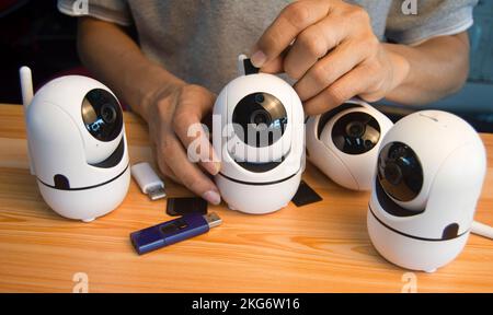 Conceptual man operating ip camera Stock Photo