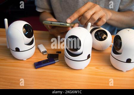 Conceptual man operating ip camera Stock Photo