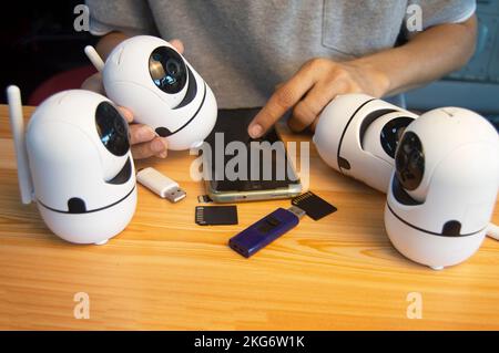 Conceptual man operating ip camera Stock Photo