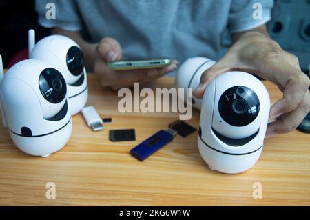 Conceptual man operating ip camera Stock Photo