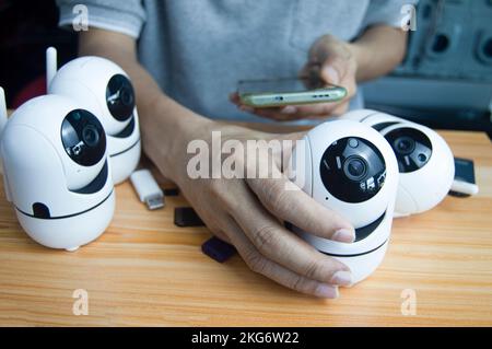 Conceptual man operating ip camera Stock Photo