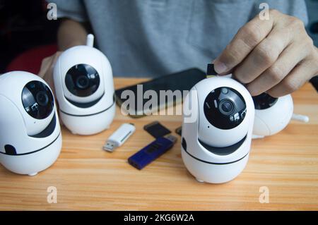 Conceptual man operating ip camera Stock Photo