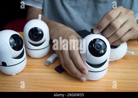 Conceptual man operating ip camera Stock Photo