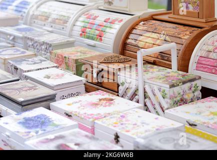 Wooden boxes decorated with decoupage technique on the market Stock Photo