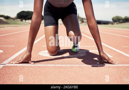Start running and sports with black woman on stadium ground for training, stamina and workout. Strong, energy and stamina with runner and ready for