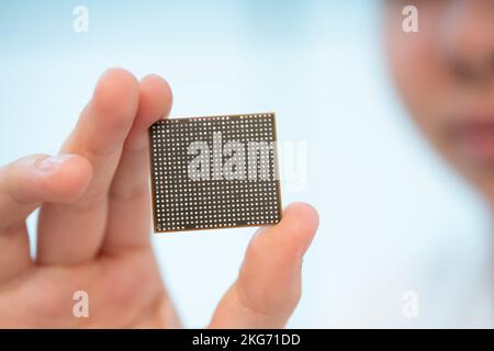 GPU crystal for use in laptops and tablets in the hands of a young woman Stock Photo