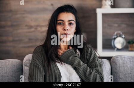 Anxiety, worry and woman breathing on sofa to relax, calm down and stress relief from panic attack. Mental health, depression and portrait of anxious Stock Photo