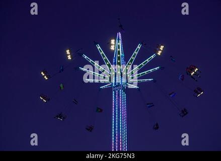 Colorful amusement Ride in the sky.  Swings in a quiet park on an autumn day, capturing a peaceful moment Stock Photo