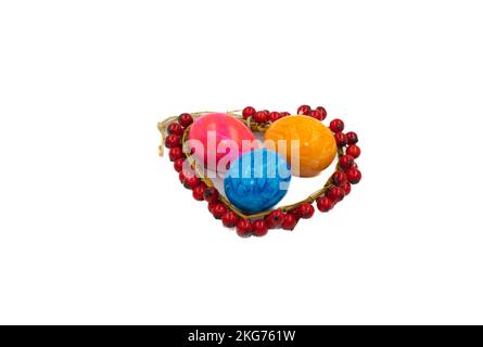Colorful Easter eggs arranged on a white background in a close-up top view, perfect for spring and holiday-themed designs. Vivid colors and intricate Stock Photo