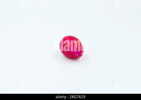 Colorful Easter eggs arranged on a white background in a close-up top view, perfect for spring and holiday-themed designs. Vivid colors and intricate Stock Photo