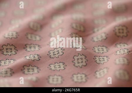 Wavy pastel silk fabric with print for sewing Stock Photo