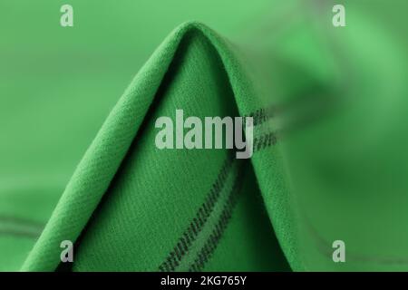 Green woolen fabric with black lines, textile cloth texture background Stock Photo