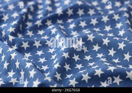 Blue wavy fabric with white stars texture background Stock Photo