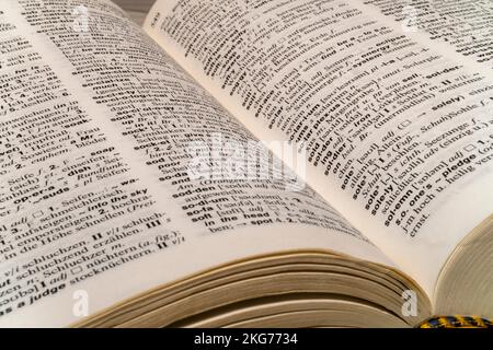 Gronau, NRW, Germany, 12.14.2021: English German dictionary. Dictionary pages and items. German English translation, Education and learning foreign la Stock Photo