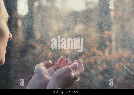 Close up woman catching raindrops concept photo Stock Photo