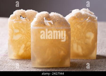 Soap with loofah sponge inside. Glycerin soaps with natural scrub. Stock Photo