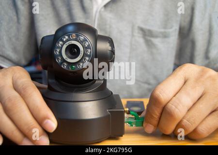 Conceptual man operating ip camera Stock Photo