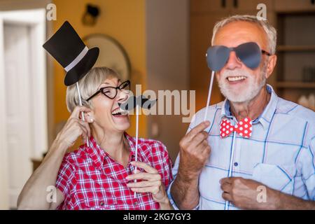 Happy mature couple is having fun at home. Stock Photo