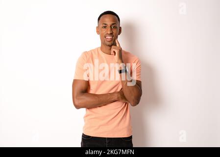 young man thinking isolated over white background. Stock Photo