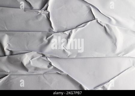 Corrugated pieces of white paper on white background Stock Photo