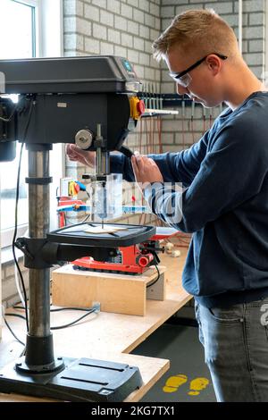 Students working with a drill in the technasium of a secondary school. Holland. vvbvanbree fotografie. Stock Photo
