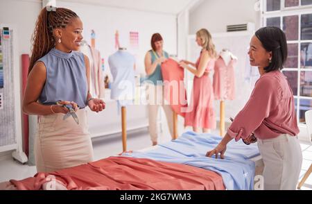Designer, fashion collaboration team and women working on dress design, creative fabric choice and teamwork diversity. Textile seamstress, material Stock Photo