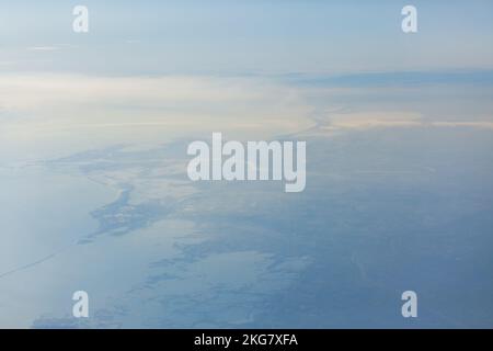 Aerial View of Earth . Flying over coastal land Stock Photo