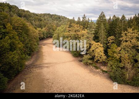 Landscape feature, dried channel river on the forest hill, after long summer drought season, drone shot. Stock Photo