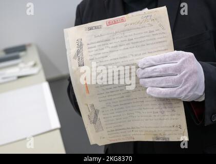 Munich, Germany. 22nd Nov, 2022. Wilhelm Füßl, longtime head of the German Museum's archive, shows the documents marked 'Secret' from the German nuclear program during a press tour of the German Museum's archive. Credit: Peter Kneffel/dpa/Alamy Live News Stock Photo