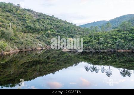 Vanadal water retention wiith clouds reflecting in the water, in la Garde-Freinet,in Massif des Maures,  in South of France, in Europe, in Provence. Stock Photo
