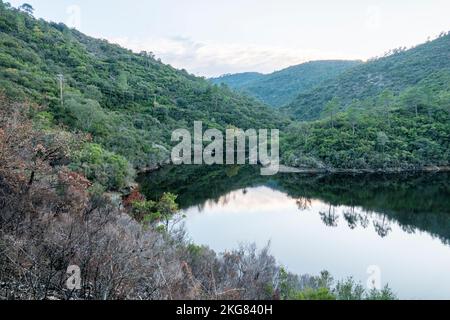 Vanadal water retention wiith clouds reflecting in the water, in la Garde-Freinet,in Massif des Maures,  in South of France, in Europe, in Provence. Stock Photo
