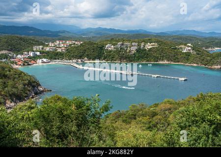 Harbor at Santa Cruz Bay & Mexican navy ship at cruise ship dock in the Bahias of Huatulco on the Pacific Coast of Oaxaca, Mexico.  The ship is P388, Stock Photo