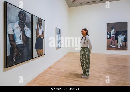 London, UK. 22nd Nov, 2022. Fever of Lilies, 2016, with For the Sake of Angels, 2018 - Fly in League with the Night - A survey exhibition of British artist Lynette Yiadom-Boakye at Tate Britain. Widely considered to be one of the most important painters working today, she is known for her eingmatic and atmospheric paintings depicting human subjects crafted from her own imagination. Credit: Guy Bell/Alamy Live News Stock Photo