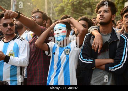 Dhaka, Bangladesh. 22nd Nov, 2022. Football fans watch the Qatar 2022 World Cup Group C football match between Argentina and Saudi Arabia on a big screen, in Dhaka, Bangladesh, on November 22, 2022. Credit: Mamunur Rashid/Alamy Live News Stock Photo